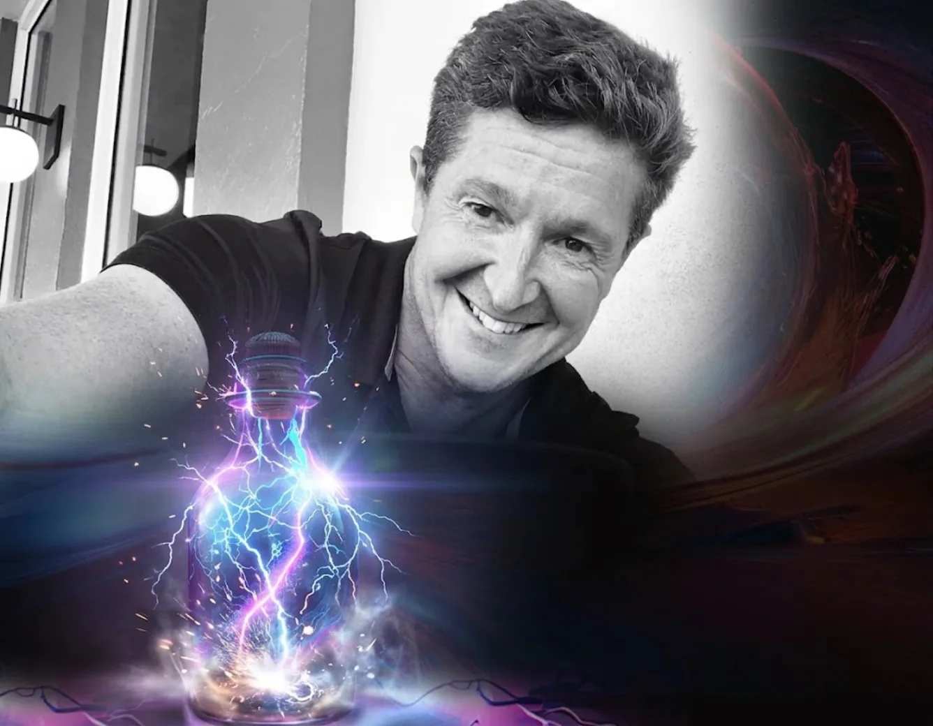 Jason Stevens smiling behind a glass bottle holding a bolt of purple lightning