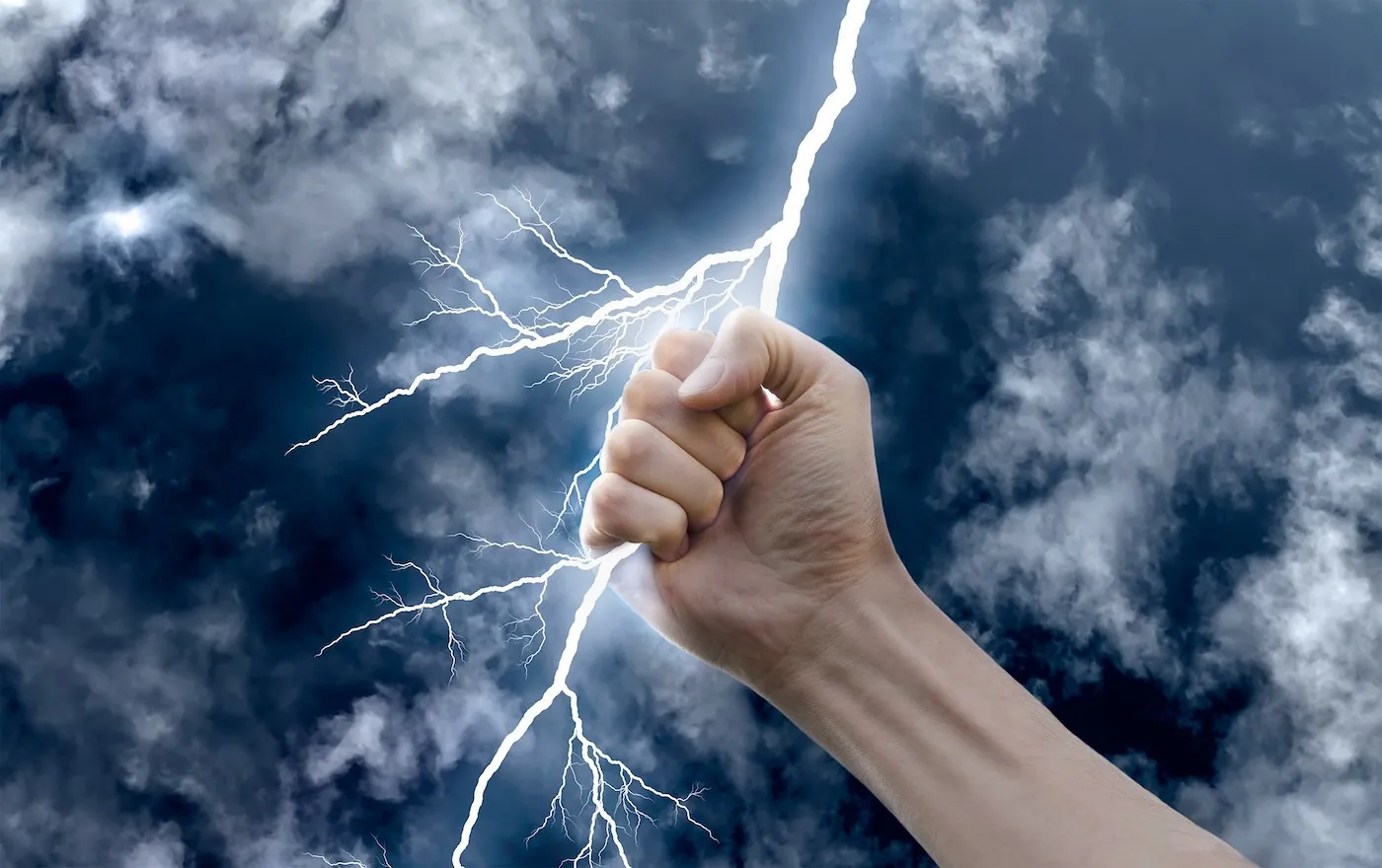 A fist gripping a bolt of lightning against storm clouds